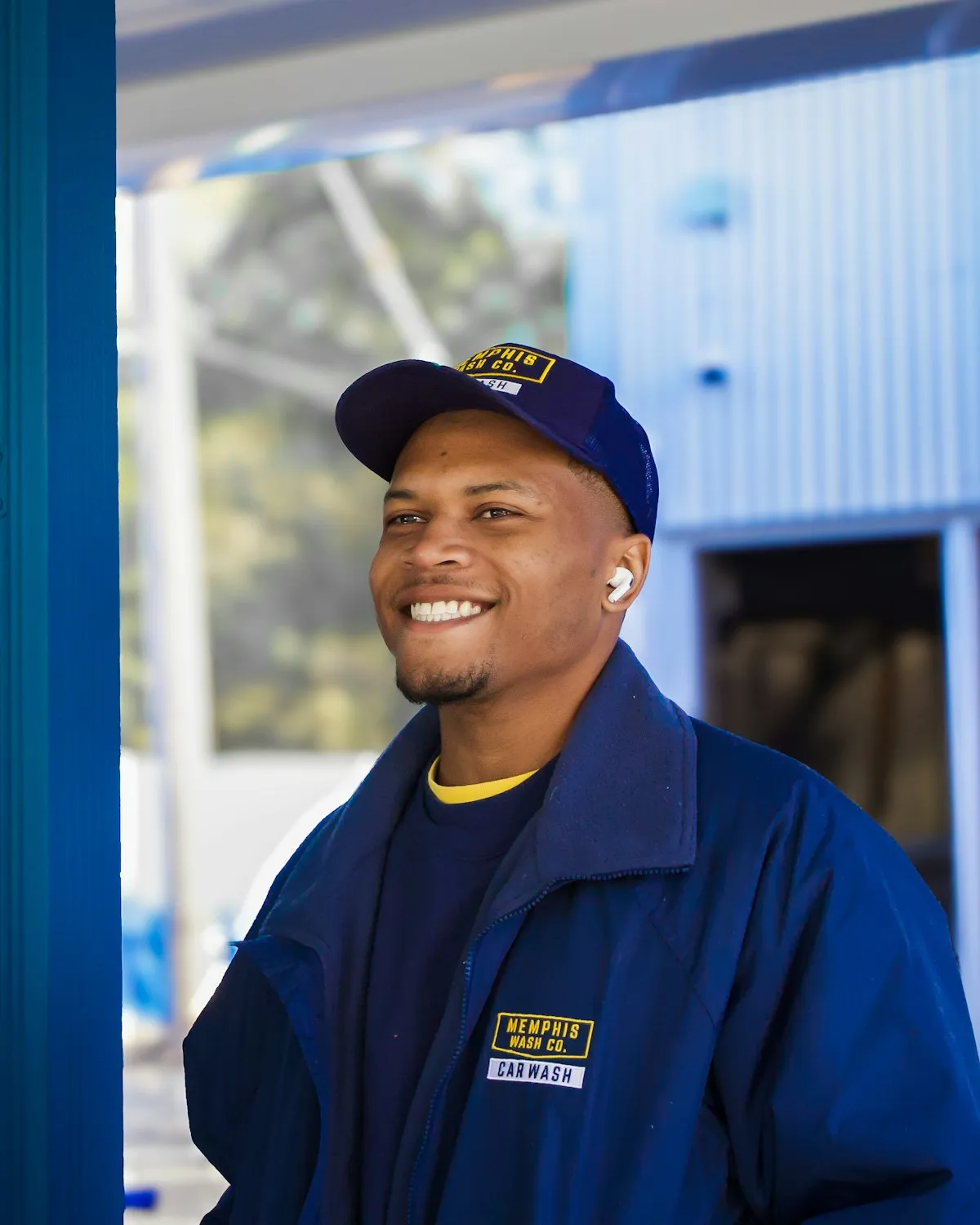 A technician on site, smiling, between jobs.