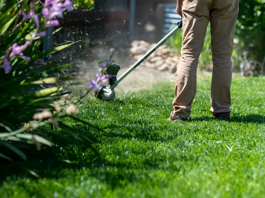A tradesman at work outdoors with a power tool.